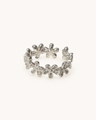 Silver floral open ring on ivory background