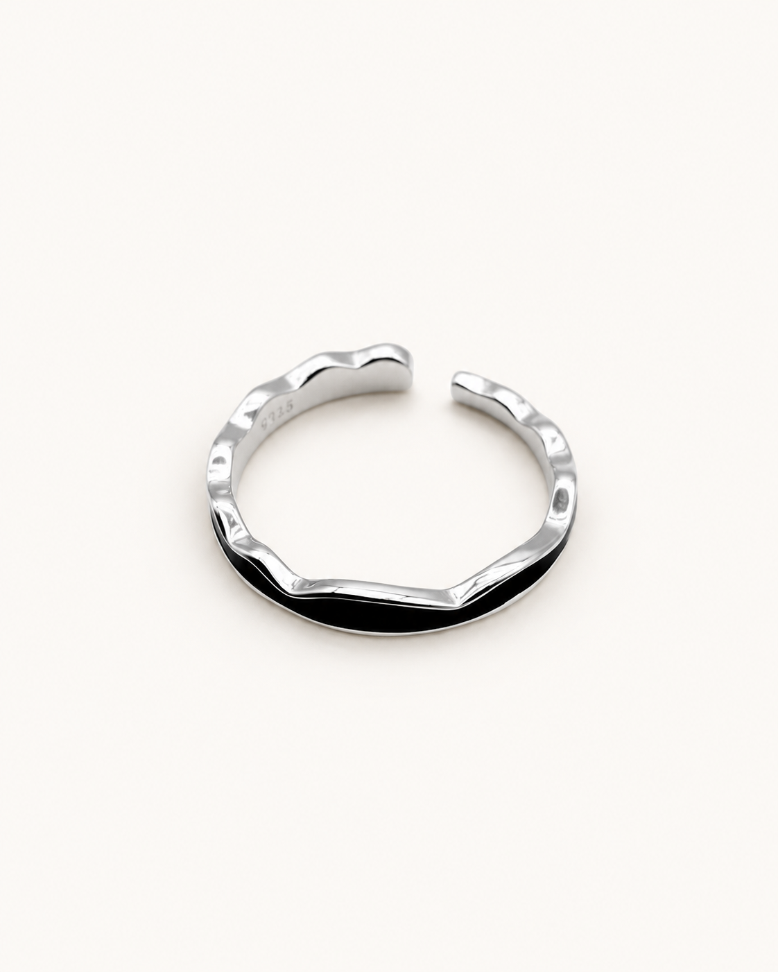 Sterling silver open ring on ivory background