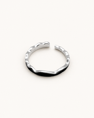 Sterling silver open ring on ivory background